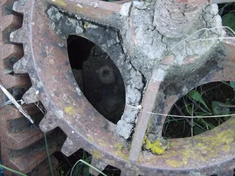 Ancient bevel drive engineered cogs to drive a water well mechanism Stock Photos
