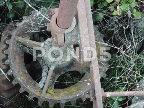 Ancient bevel drive engineered cogs to drive a water well mechanism Stock Photos