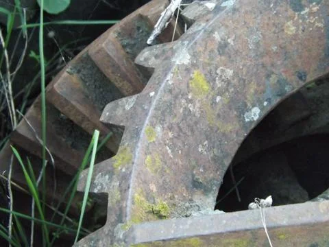 Ancient bevel drive engineered cogs to drive a water well mechanism Stock Photos