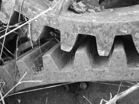 Ancient bevel drive engineered cogs to drive a water well mechanism Stock Photos