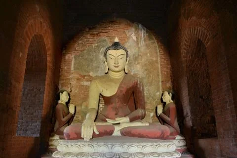 Ancient big Buddha statue inside old pagoda in Bagan, Myanmar Stock Photos