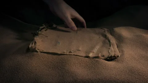 Ancient Book Picked Up From The Sand In Cave Stock Footage 194519941