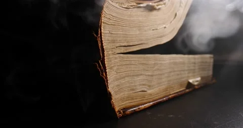 Ancient book side view smoke swirling opening book Stock Footage 205492753