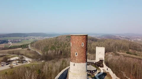 Ancient brick and stone towers overlooking rural valley landscape Video stock 342027804