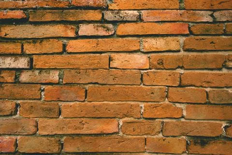 The ancient brick wall background, old brick wall. Stock Photos