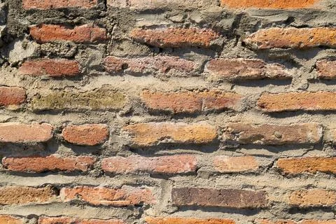 Ancient brick wall. Backgrounds and textures. Rough surface. Stock Photos