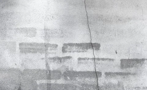 Ancient brick wall with the partial destroyed old plaster in mon Stock Photos