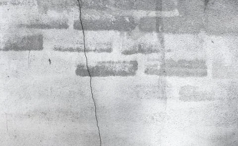 Ancient brick wall with the partial destroyed old plaster in mon Stock Photos