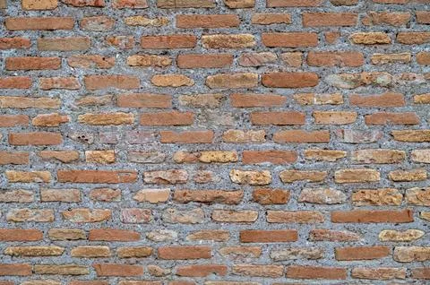 Ancient Brick Wall in Rome with Trees,,Weathered Stone Stock Photos