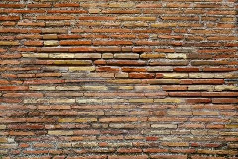 Ancient brickwork of flat roman bricks Stock Photos