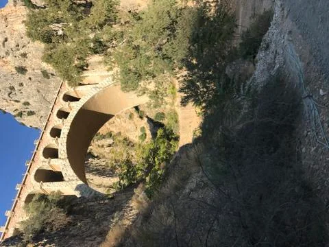 Ancient bridge between two mountains Stock Photos