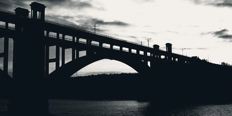 Ancient bridge passing through the river, evening sunset, retro photo Stock Photos