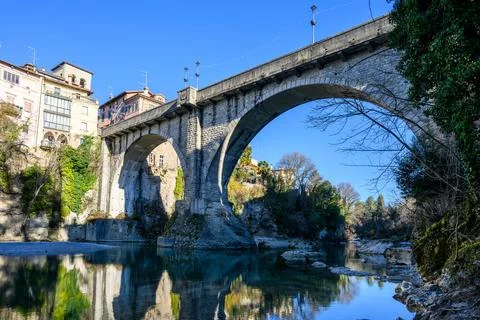 Ancient Bridge Reflecting in River. Stock Photos