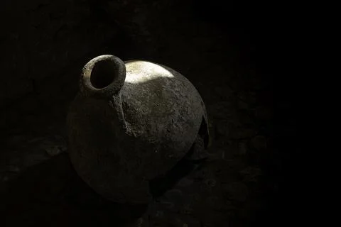 An ancient broken vessel with a sunlight Stock Photos