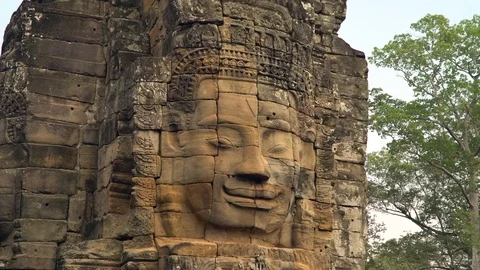 Ancient Buda face at Bayon temple, angkor thom, Siem Reap, Cambodia 스톡 동영상 77167276