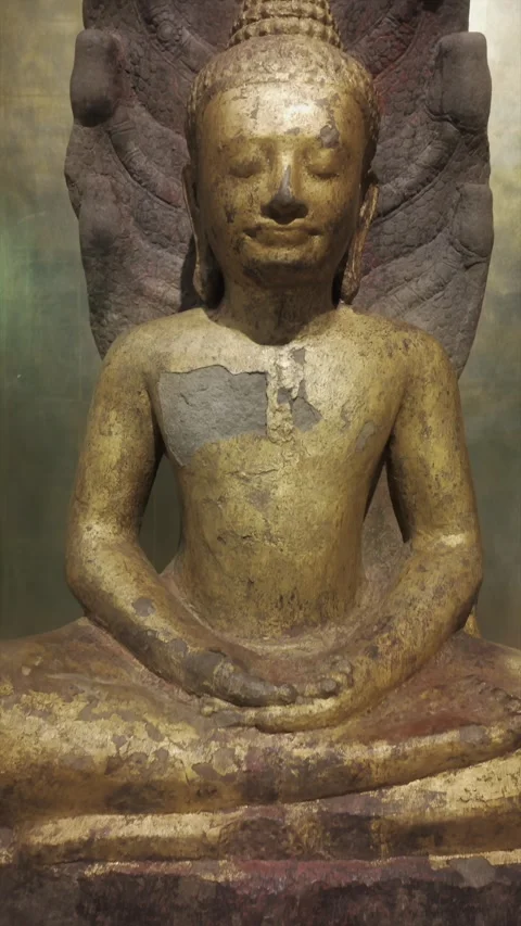 Ancient Buddha statue with Naga serpent hood, Siem Rep, Cambodia Stock Footage 335418022