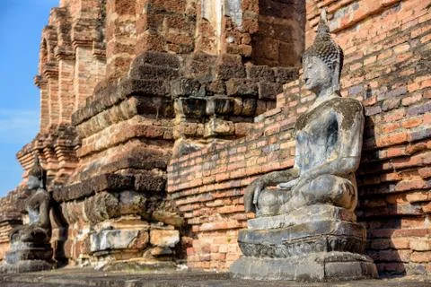 Ancient Buddha statue sitting posture Stock Photos