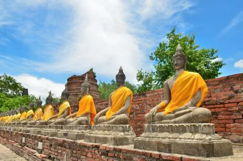 Ancient buddha statues with blue sky at wat yai chaimongkol Stock Photos