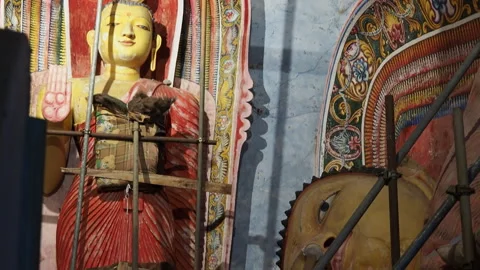 Ancient buddhist statues undergoing restoration work Stock Footage 340641223
