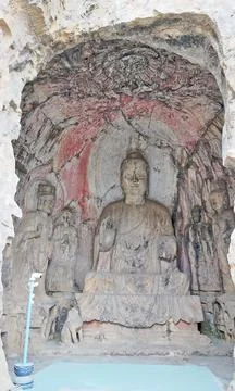 Ancient Buddhist stone statue inside Longmen grotto Stock Photos