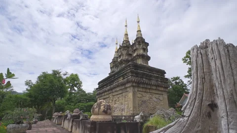 Ancient Buddhist temple pagoda with moving clouds, Thailand Stock Footage 337519341