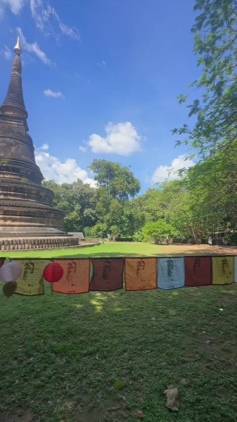 Ancient Buddhist temple with prayer flags, Chiang Mai, Thailand Stock Footage 336767597