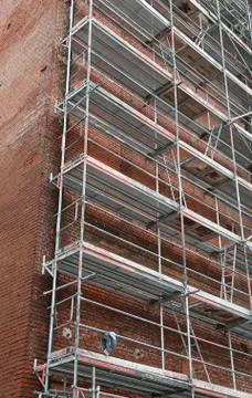 Ancient building during maintenance works with the big metal scaffold for wor Fotos de archivo