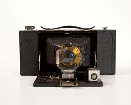 Ancient camera in front view Stock Photos