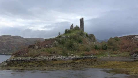 Ancient Castle Moil ruins and  abandoned boat, Kyleakin, Scotland Stock Footage 293712569
