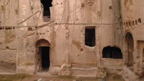 Ancient cave monastery surrounded by stone walls in Cappadocia, Turkey Stock Footage 124271777