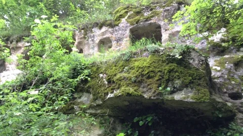 Ancient cave in mountain forest at Mangup Kale - Crimea , Russia Stock Footage 73717269