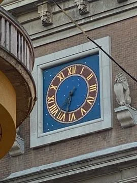 Ancient celestial clock face with Roman numerals showing the current time. .. Stock Photos