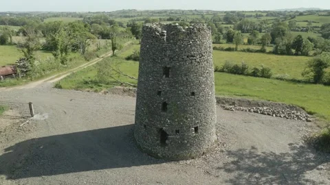 Ancient Celtic Round Tower In Ireland - aerial drone shot Stock Footage 251522706