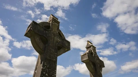 Ancient celtic stone crosses standing against a dramatic moving cloudy sky. Stock Footage 337276057