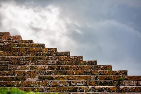 Ancient city stairway perspective on blue cloudy sky background Stock Photos