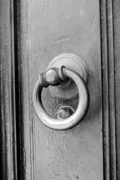 Ancient clapper on an ancient door Фото