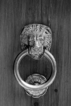 Ancient clapper on an ancient door 스톡 사진