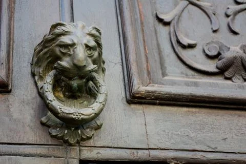 Ancient clapper on an ancient door 스톡 사진