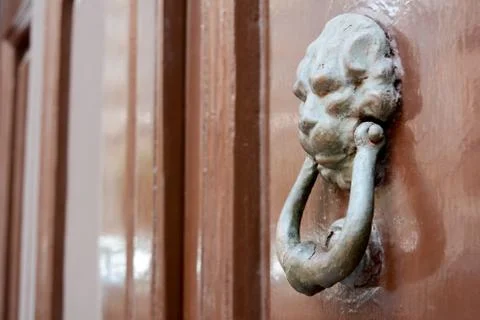 Ancient clapper on an ancient door Фото