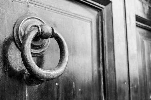 Ancient clapper on an ancient door Фото