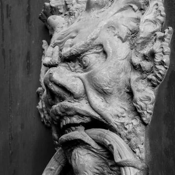 Ancient clapper on an ancient door Фото
