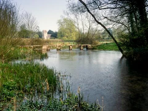 Ancient clapper bridge over the  River Leach 스톡 사진