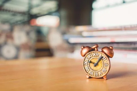 Ancient clock and stack of book 写真素材