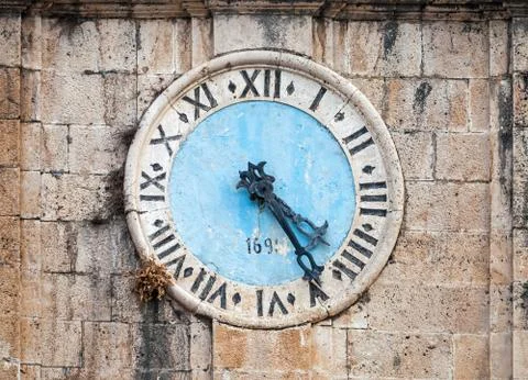 Ancient clock tower of central Saint Nicholas Church, Perast town, Montenegro Stock Photos