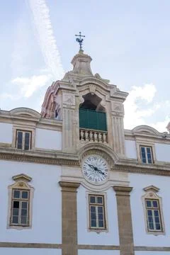Ancient clock tower with weather vane Stock Photos