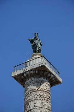 Ancient column of Marcus Aurelius with a helix relief a bronze statue of th.. Stock Photos
