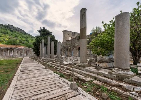 Ancient columns and wooden path at the historic Ephesus archaeological site Stock Photos