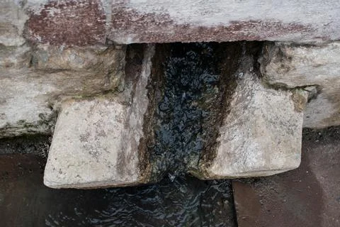 Ancient communication stones. Medieval gutter. Stock Photos