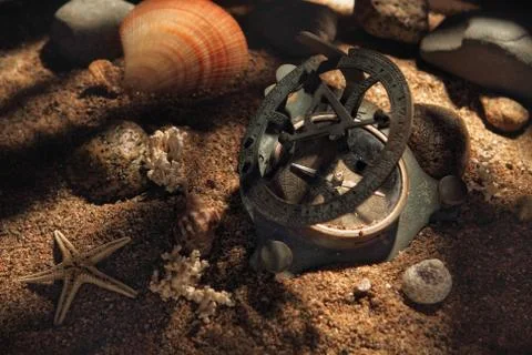 Ancient compass on the ocean floor Stock Photos