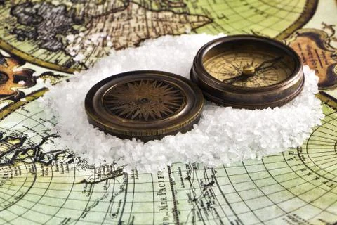 Ancient compass on the world map. Stock Photos